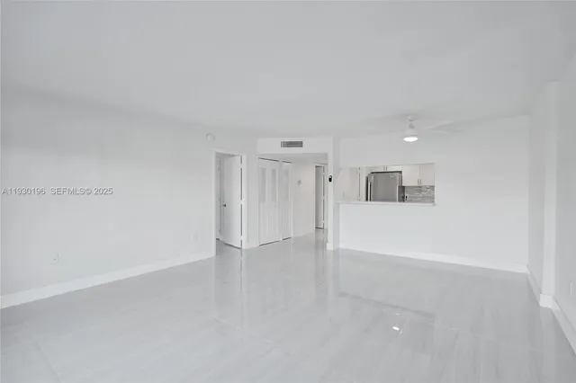 a view of a kitchen with a sink and a stove top oven