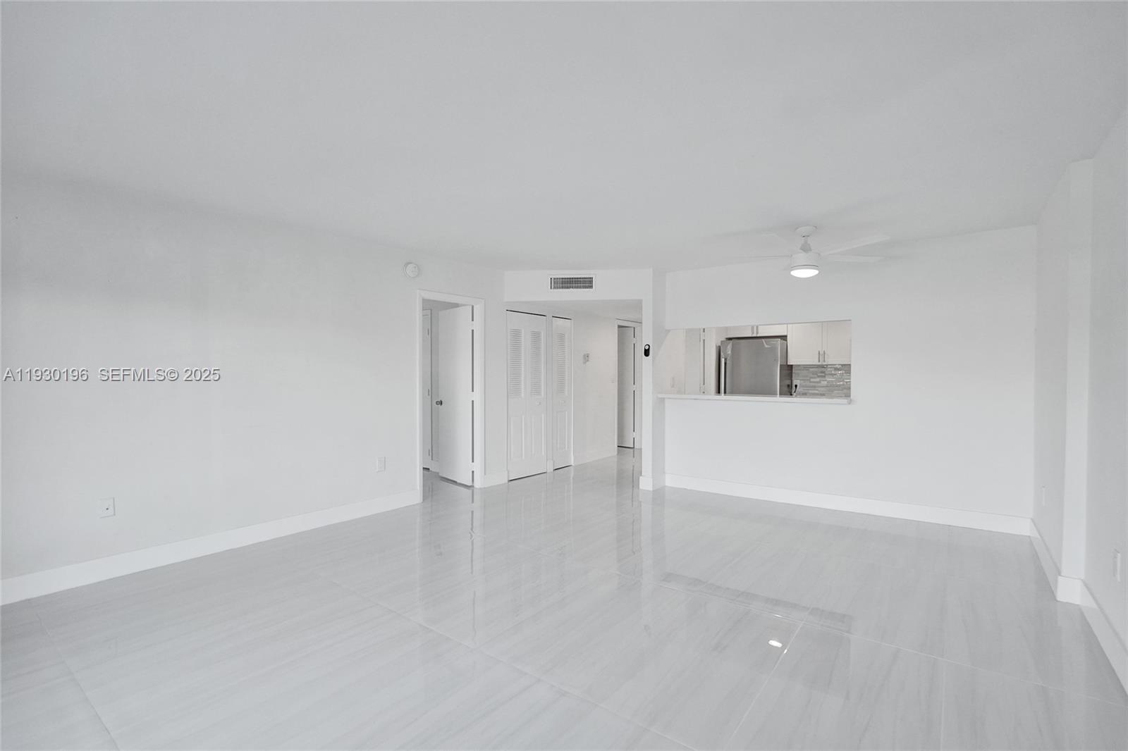 4164 Inverrary Drive, Unit 305 Lauderhill, FL 33319 - Photo 8 of 32 wooden floor in an empty room