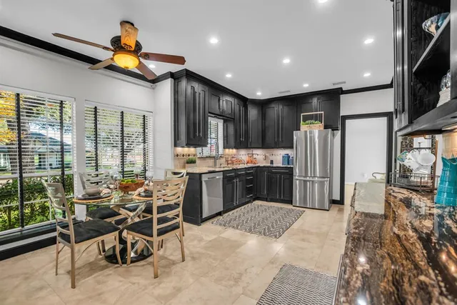 a view of a livingroom with furniture and a bookshelf
