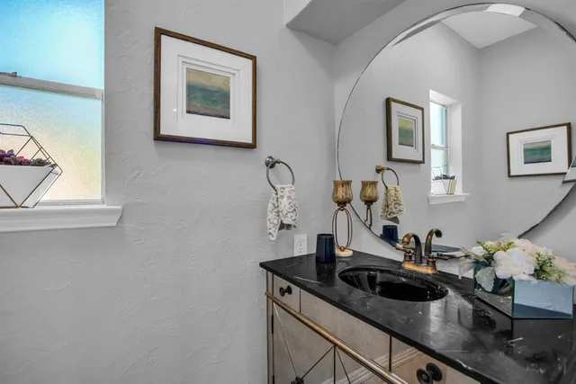 a view of a backyard with swimming pool and furniture