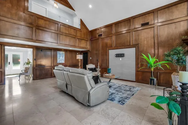 a view of empty room with window and ceiling fan