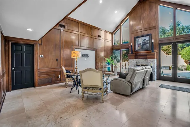 a kitchen with stainless steel appliances kitchen island granite countertop a refrigerator and a sink