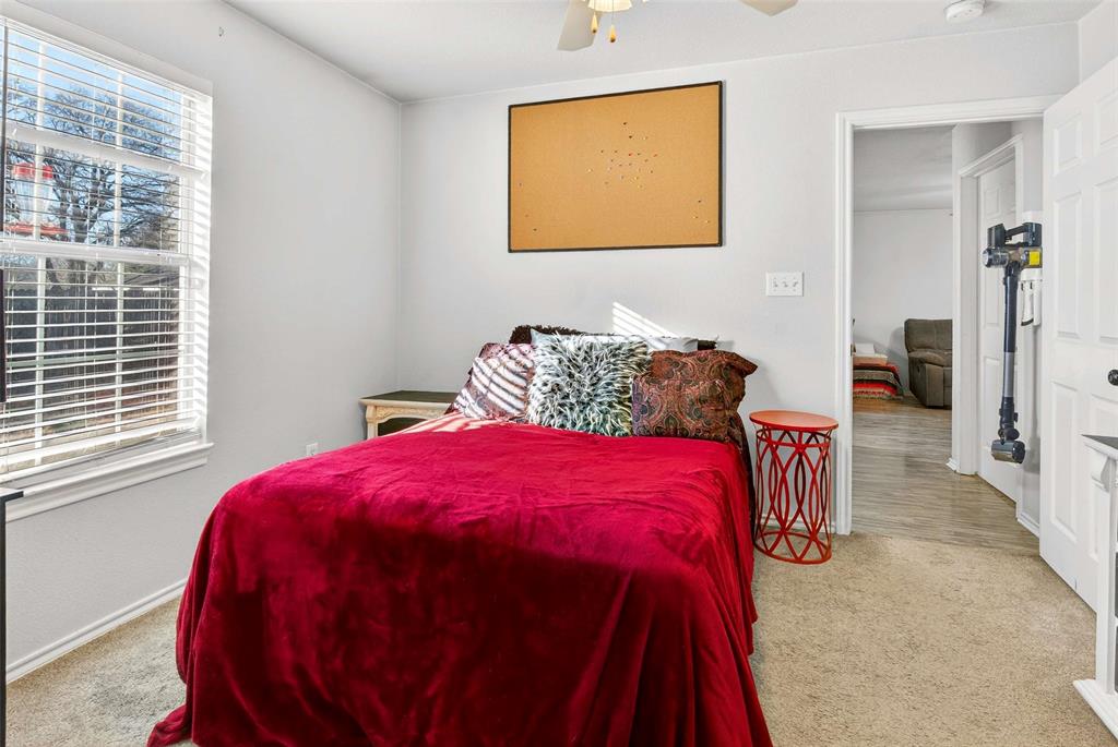 1001 South 4th Street Bonham, TX 75418 - Photo 19 of 27 a bedroom with a bed and a window
