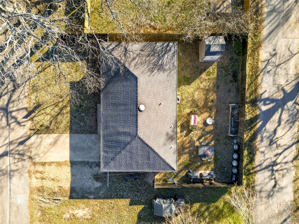 1001 South 4th Street Bonham, TX 75418 - Photo 24 of 27 a view of a house with a tree