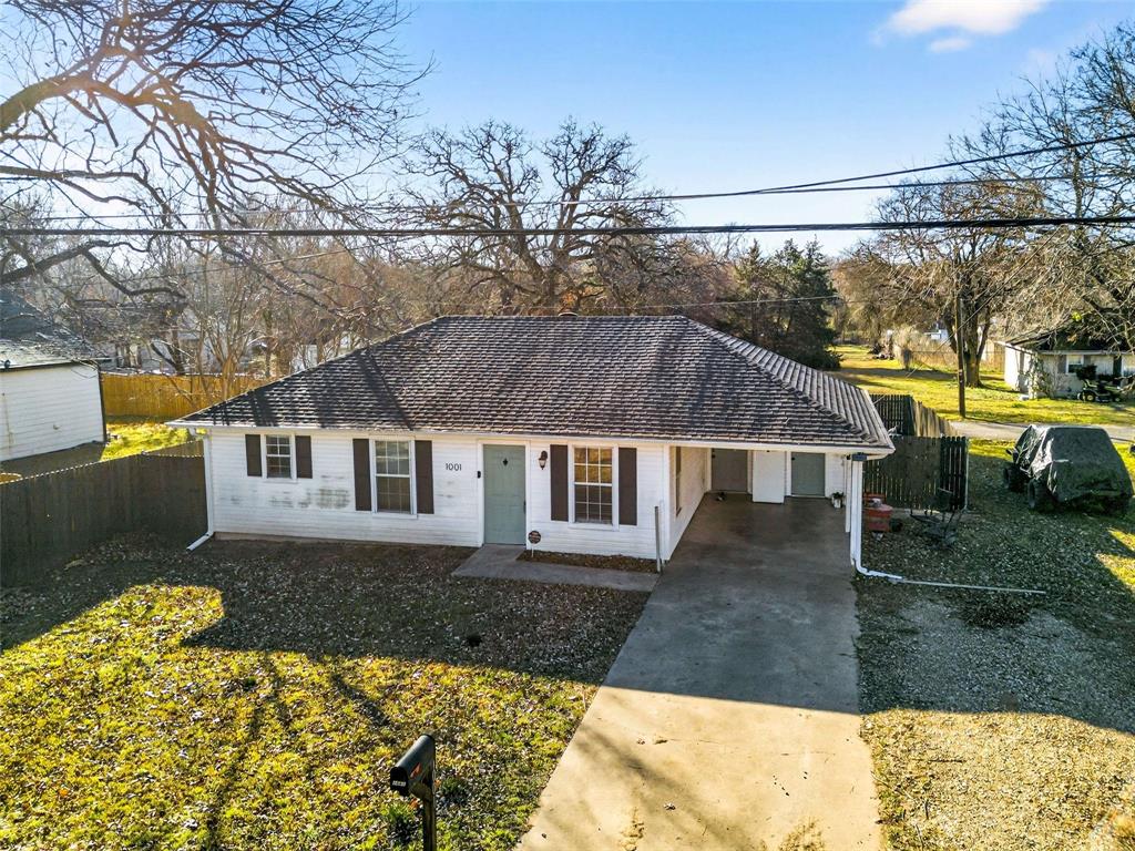 1001 South 4th Street Bonham, TX 75418 - Photo 25 of 27 a house view with a garden space