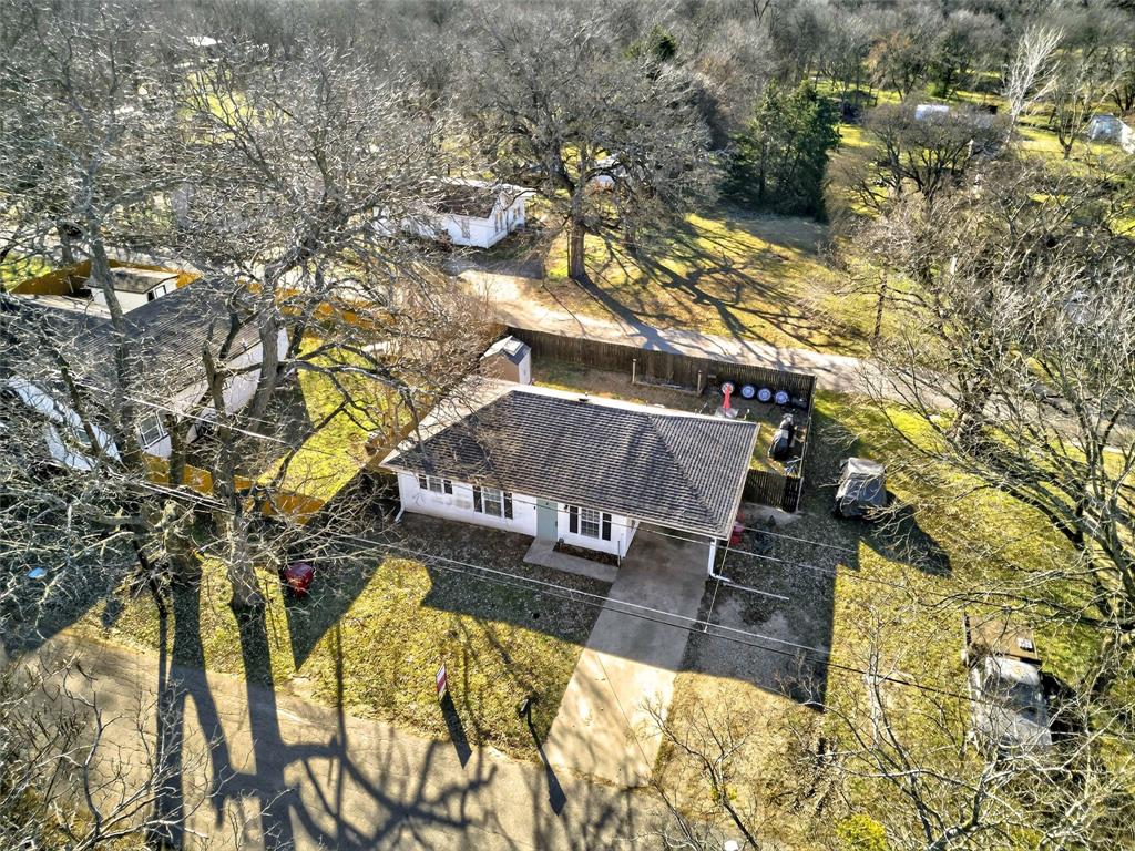 1001 South 4th Street Bonham, TX 75418 - Photo 26 of 27 a view of swimming pool with a yard