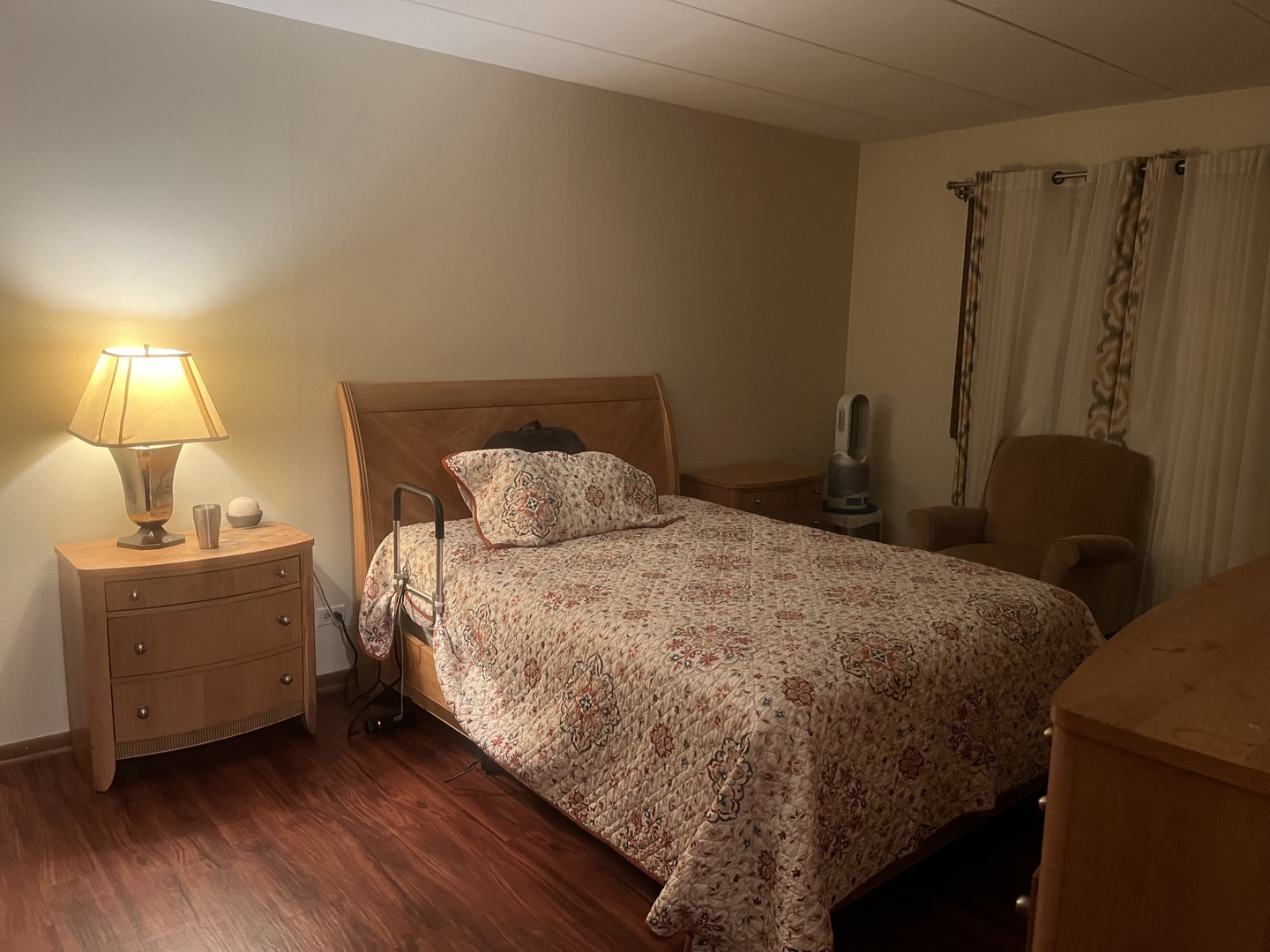 2807 Willow Road, Unit 105 Homewood, IL 60430 - Photo 2 of 8 a bed sitting in a bedroom next to a lamp
