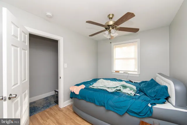 a bedroom with a bed and window