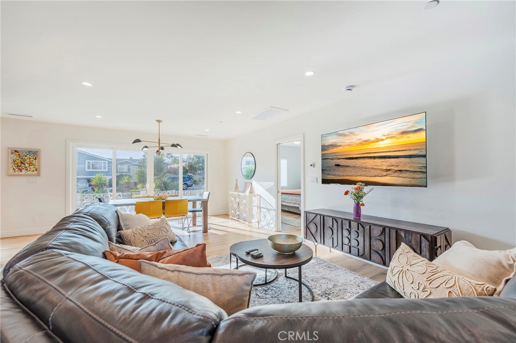 33792 Chula Vista Avenue Dana Point, CA 92629 - Photo 11 of 37 a living room with furniture kitchen view and a large window