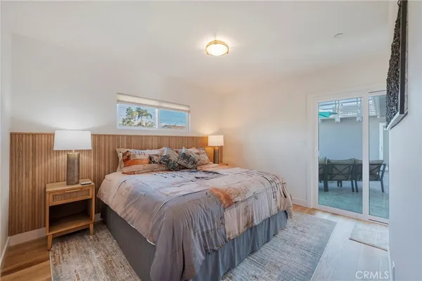 a bedroom with a bed and a mirror