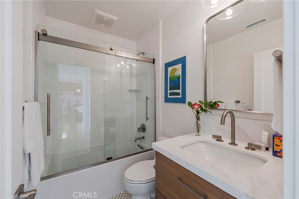 33792 Chula Vista Avenue Dana Point, CA 92629 - Photo 22 of 37 a bathroom with a sink toilet tub and shower