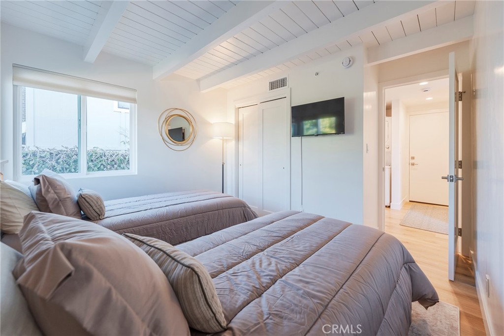 33792 Chula Vista Avenue Dana Point, CA 92629 - Photo 24 of 37 a bedroom with a bed and a window