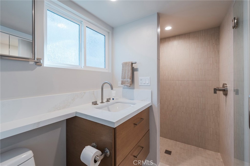 33792 Chula Vista Avenue Dana Point, CA 92629 - Photo 27 of 37 a bathroom with a sink shower and a mirror