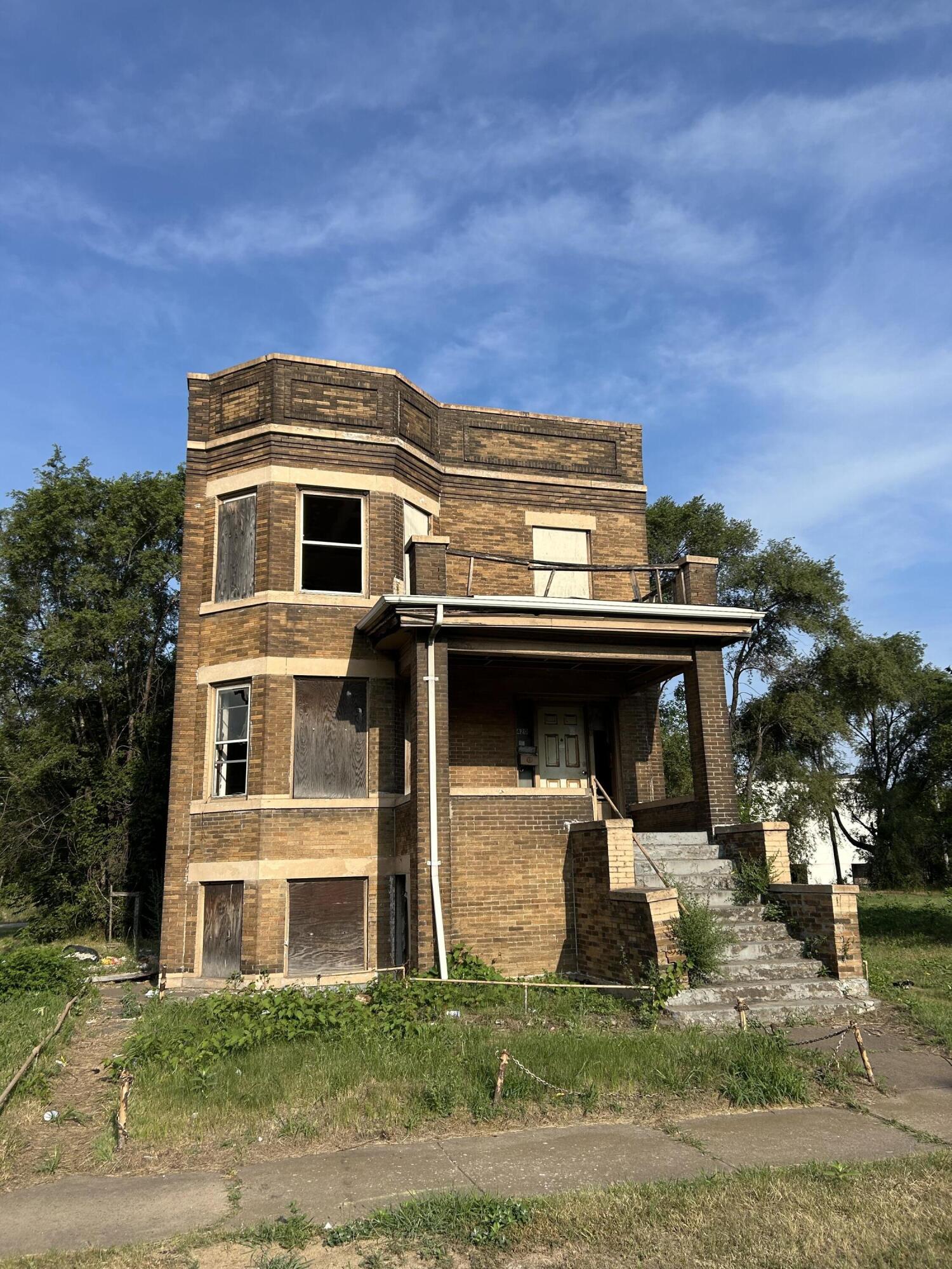 420 Adams Street Gary, IN 46402 - Photo 1 of 4 a front view of a house with a yard