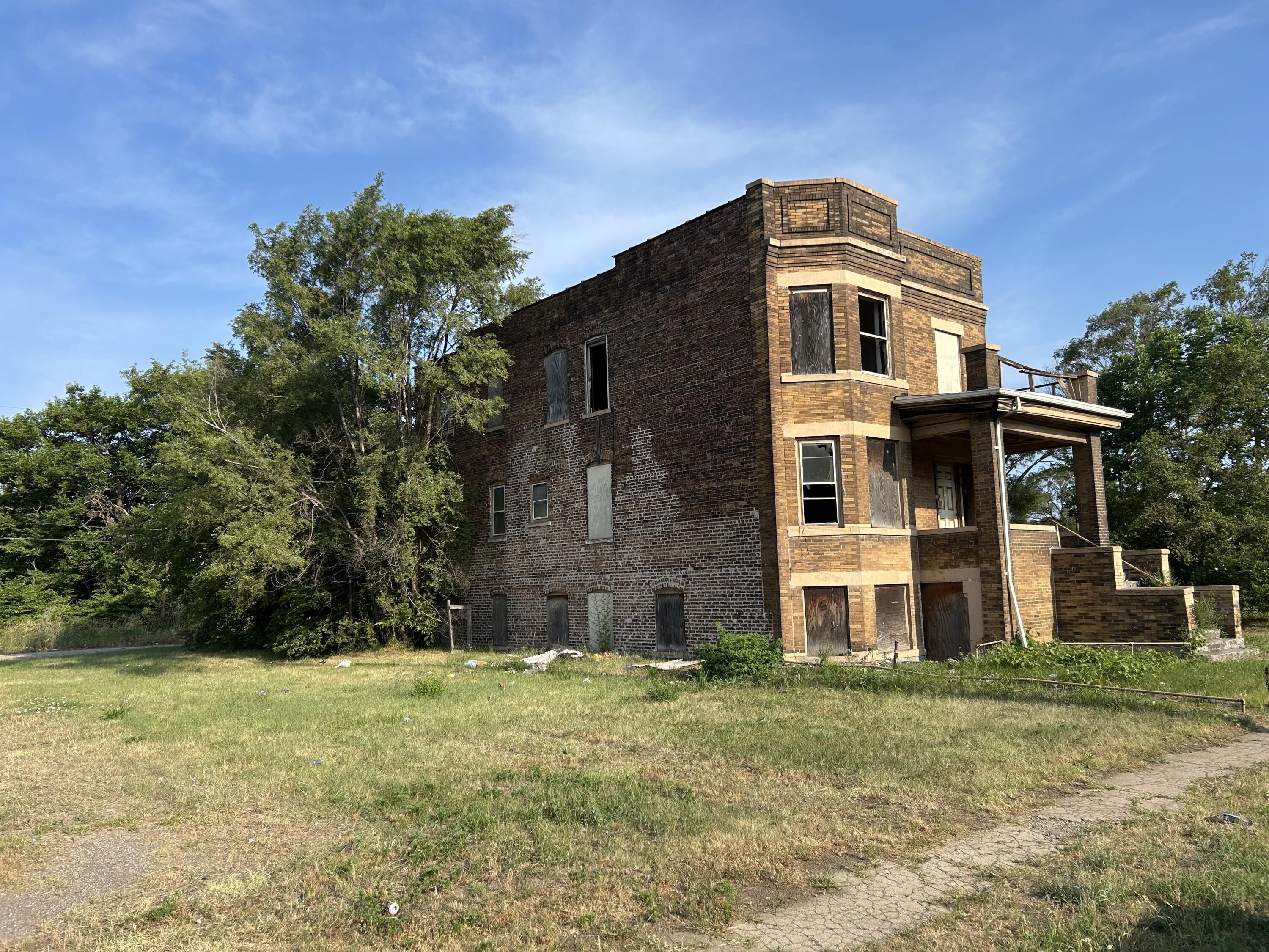 420 Adams Street Gary, IN 46402 - Photo 2 of 4 a front view of a house with a yard