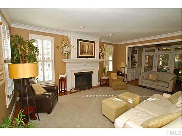 3217 Anderson Drive Raleigh, NC 27609 - Photo 8 of 25 a living room with furniture and a fireplace