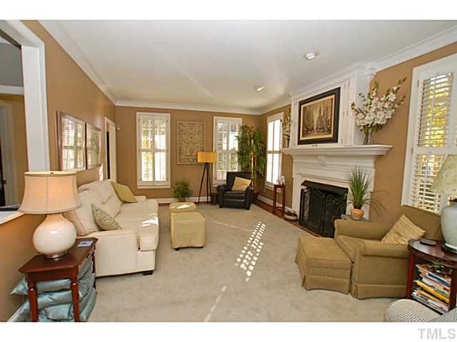 3217 Anderson Drive Raleigh, NC 27609 - Photo 9 of 25 a living room with furniture and a fireplace