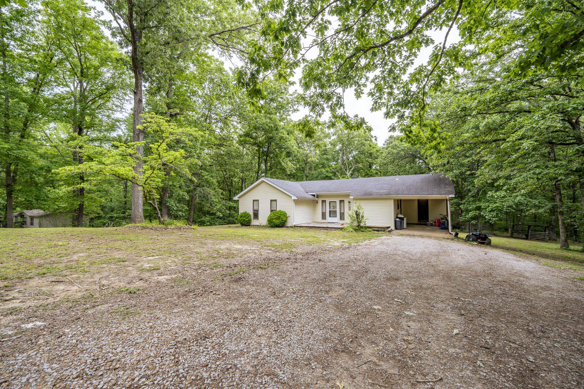 259 Oakview Drive Adamsville, TN 38310 - Photo 1 of 32 Single-story residence featuring a covered front entry and a gravel driveway
