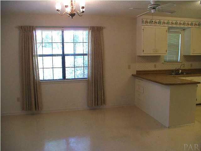 6317 Rice Street Milton, FL 32583 - Photo 3 of 14 View from Living Room into Dining Room