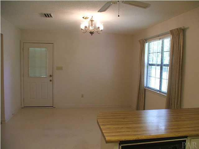 6317 Rice Street Milton, FL 32583 - Photo 4 of 14 View From Kitchen into Dining Area