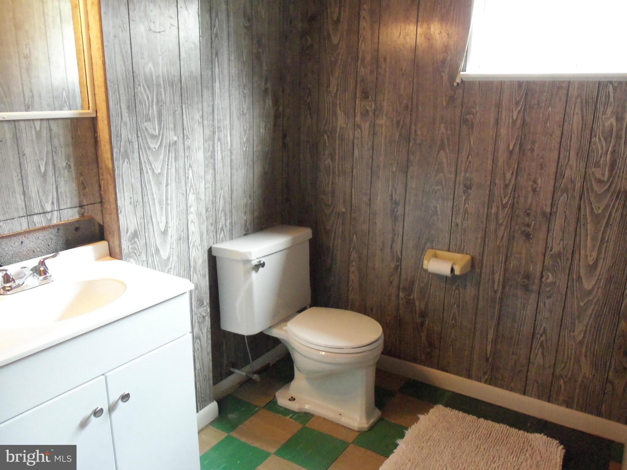 405 Penwood Road Silver Spring, MD 20901 - Photo 22 of 25 a bathroom with a sink toilet and shower