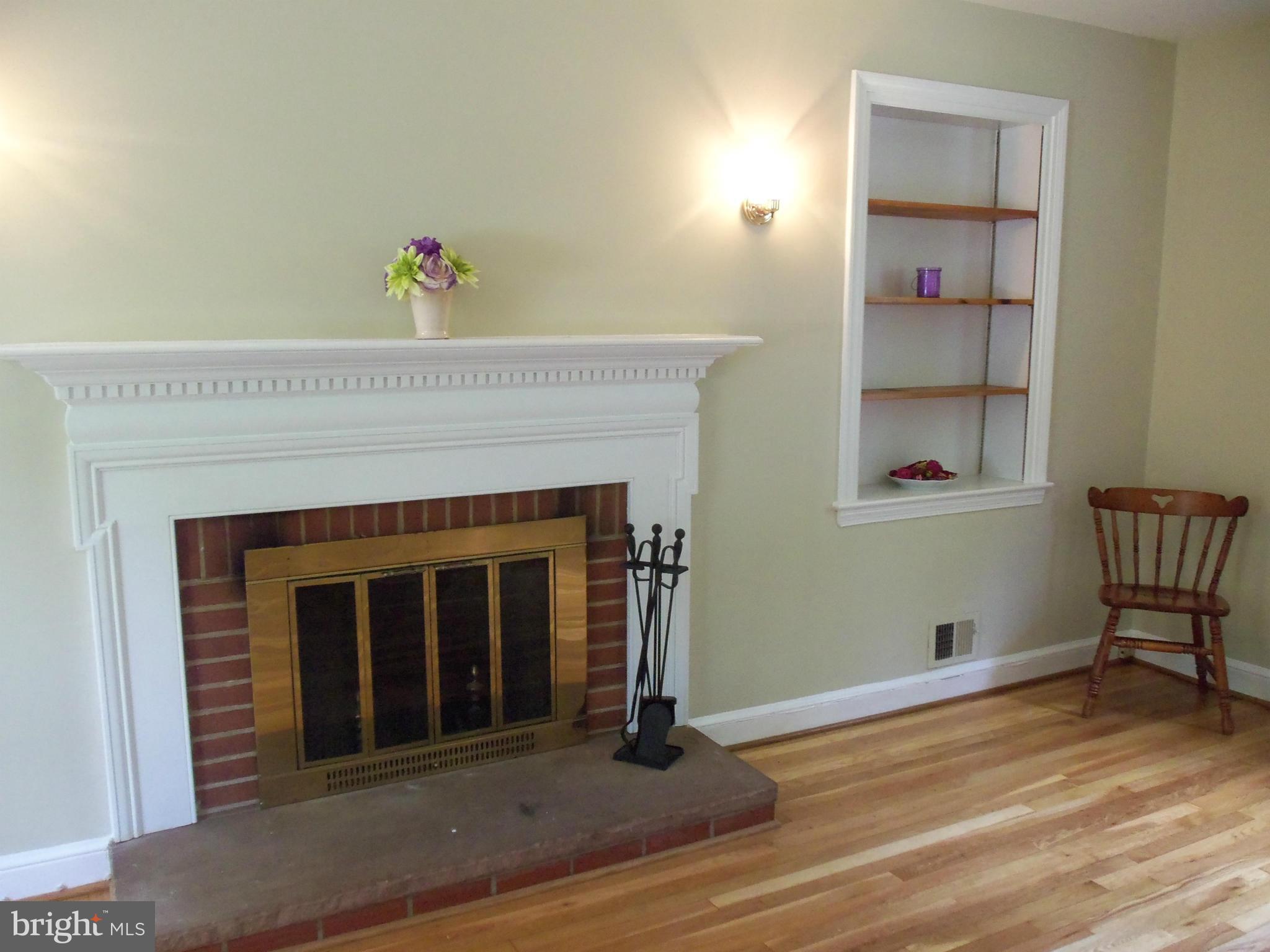 405 Penwood Road Silver Spring, MD 20901 - Photo 10 of 25 a view of a livingroom with furniture and wooden floor