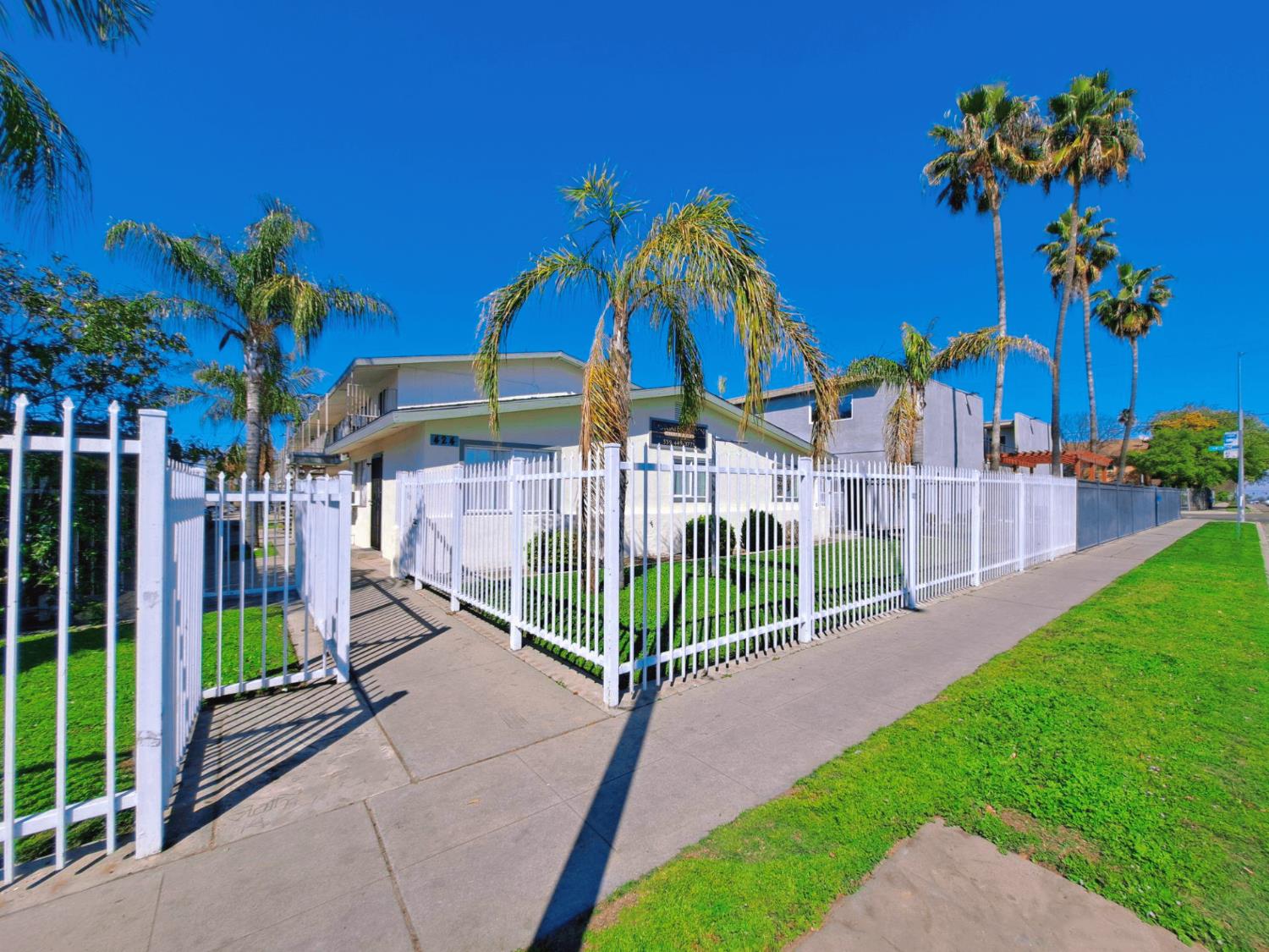 441 South Dearing Avenue Fresno, CA 93702 - Photo 2 of 9 a view of a house with a yard and potted plants