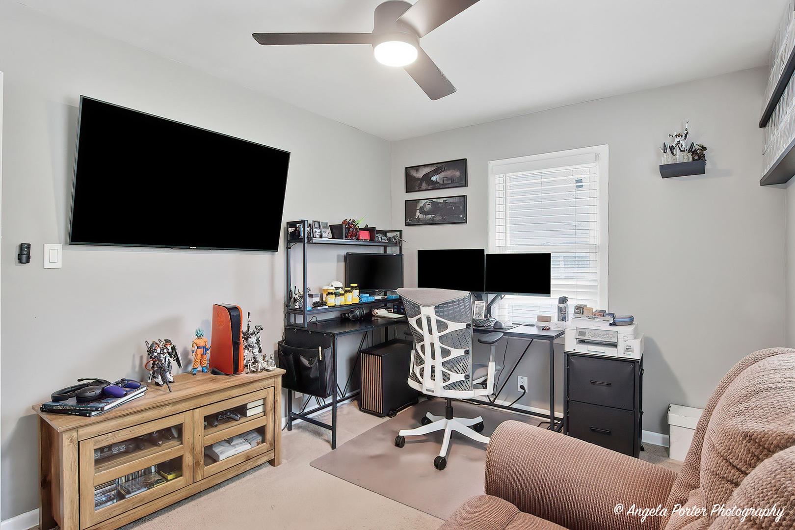 353 Marengo Road Harvard, IL 60033 - Photo 14 of 23 a view of a workspace with a window and a flat screen tv