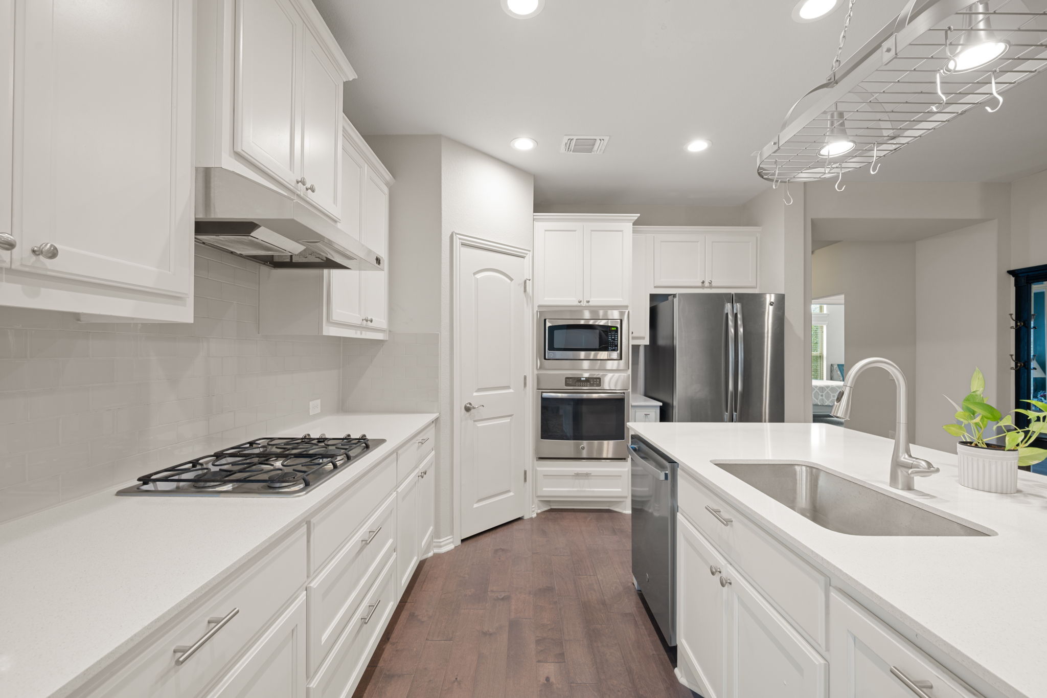 8800 Slater Drive Austin, TX 78747 - Photo 1 of 40 a kitchen with stainless steel appliances kitchen island granite countertop a sink stove and refrigerator