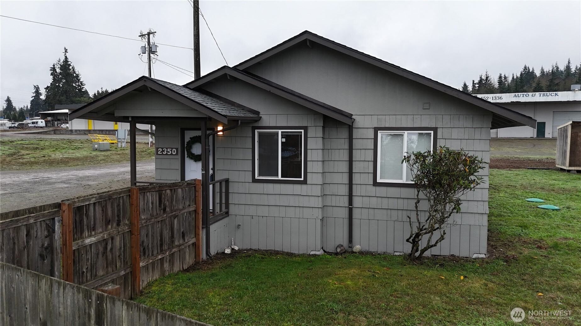 a front view of house with yard and deck