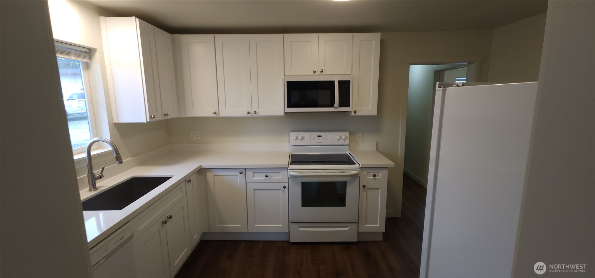 2350 East Pioneer Road Port Angeles, WA 98362 - Photo 14 of 40 a kitchen with a sink stove and microwave