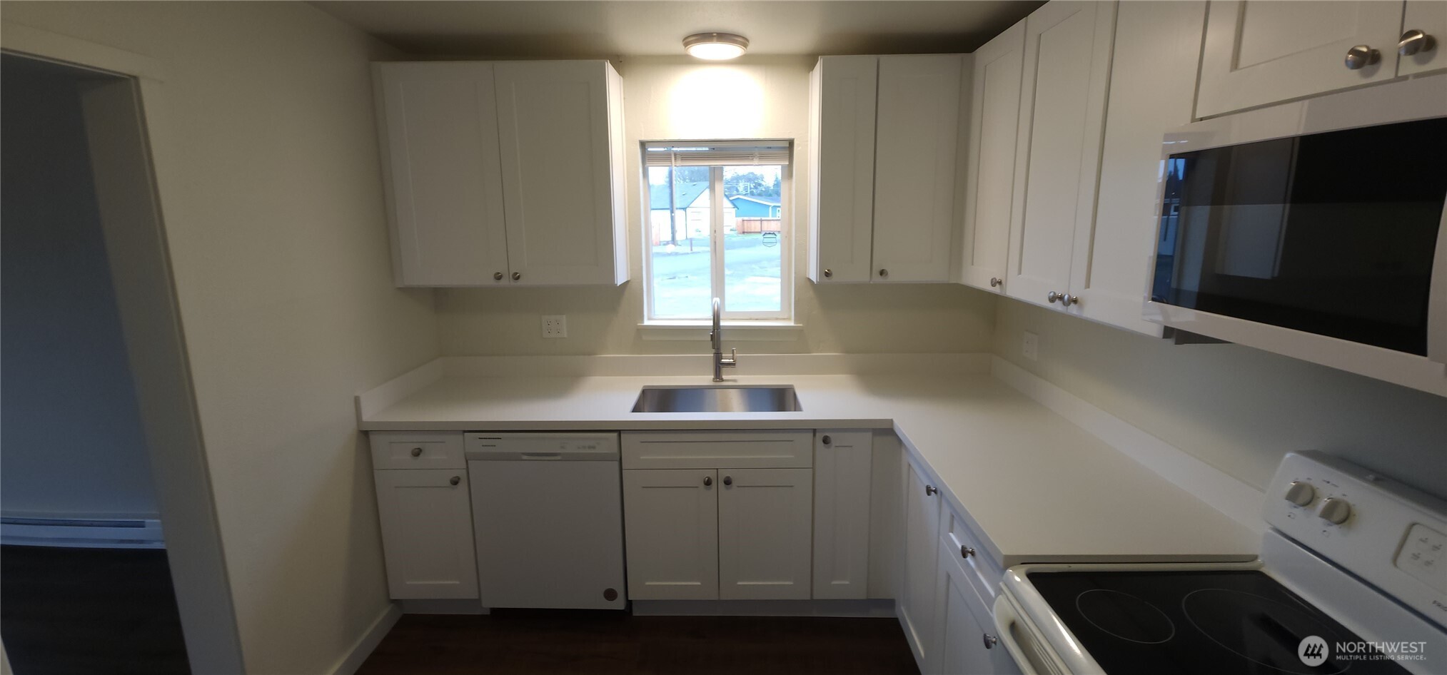 2350 East Pioneer Road Port Angeles, WA 98362 - Photo 16 of 40 a kitchen with a sink cabinets and window