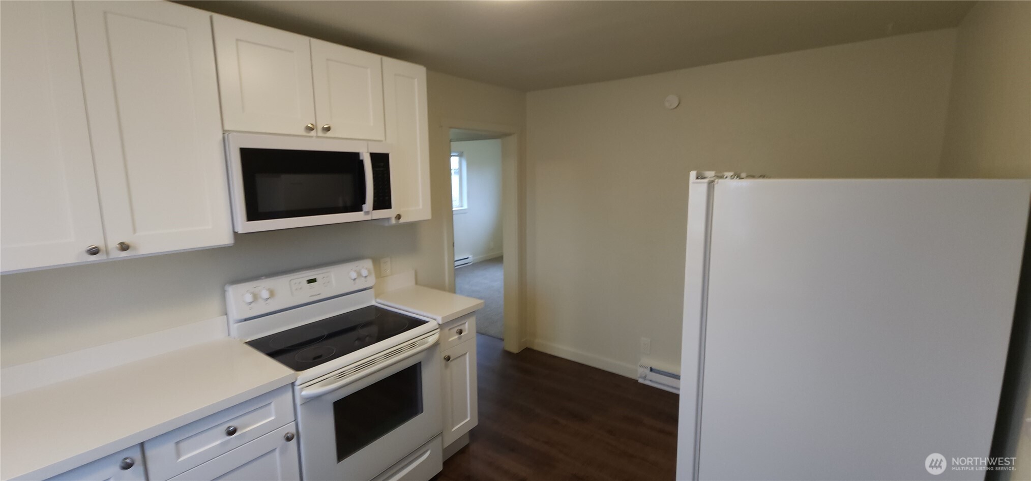2350 East Pioneer Road Port Angeles, WA 98362 - Photo 18 of 40 a kitchen with a stove and a microwave