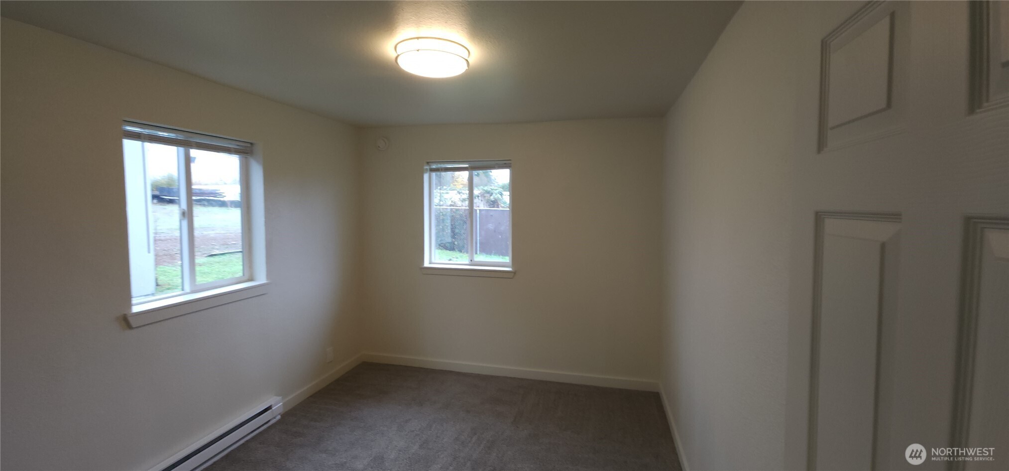 2350 East Pioneer Road Port Angeles, WA 98362 - Photo 20 of 40 an empty room with windows