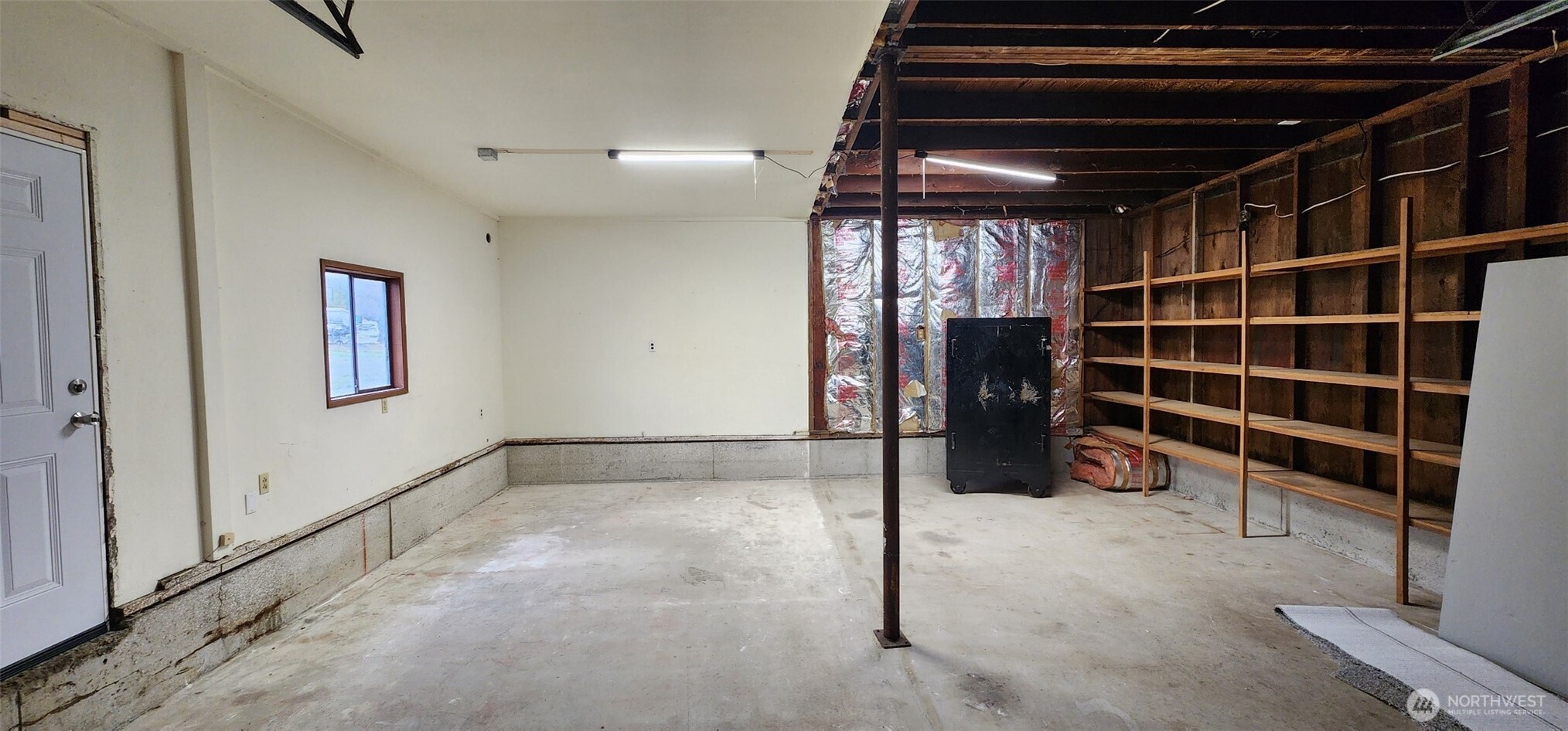 2350 East Pioneer Road Port Angeles, WA 98362 - Photo 26 of 40 a view of an empty room with furniture and a window