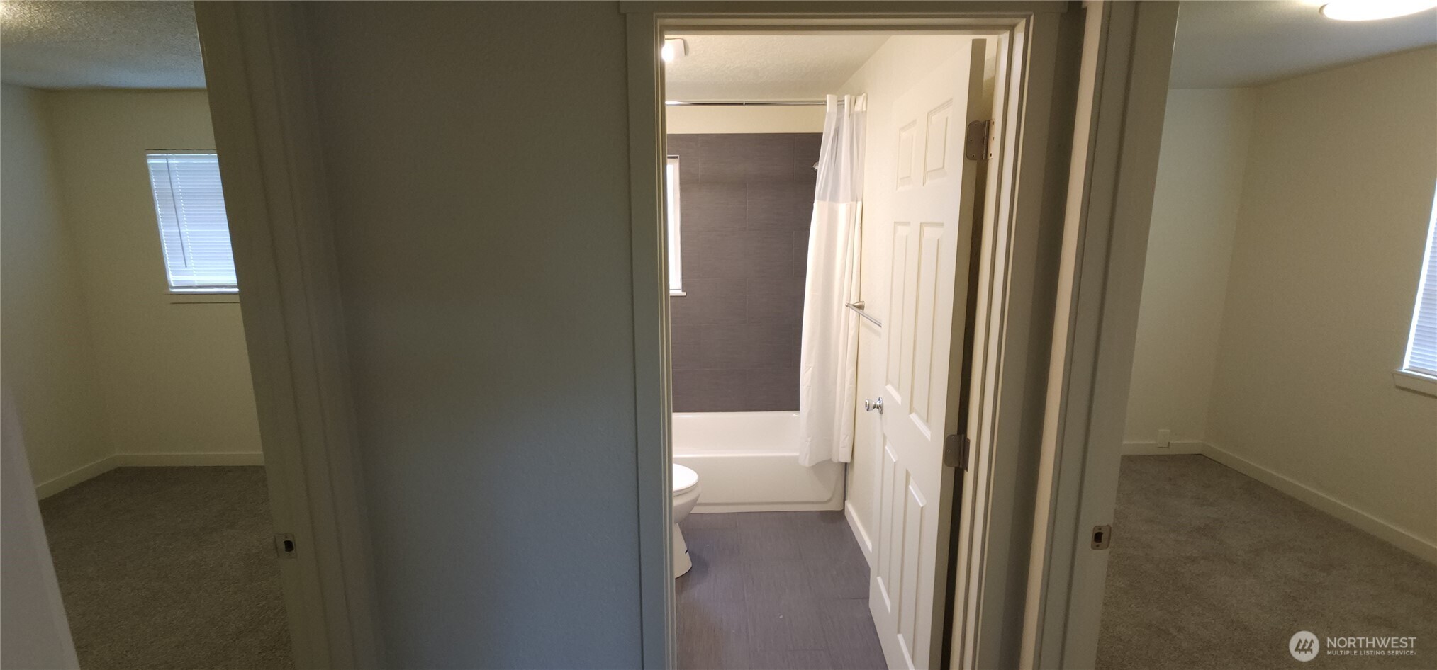 2350 East Pioneer Road Port Angeles, WA 98362 - Photo 29 of 40 a view of a bathroom from a corridor