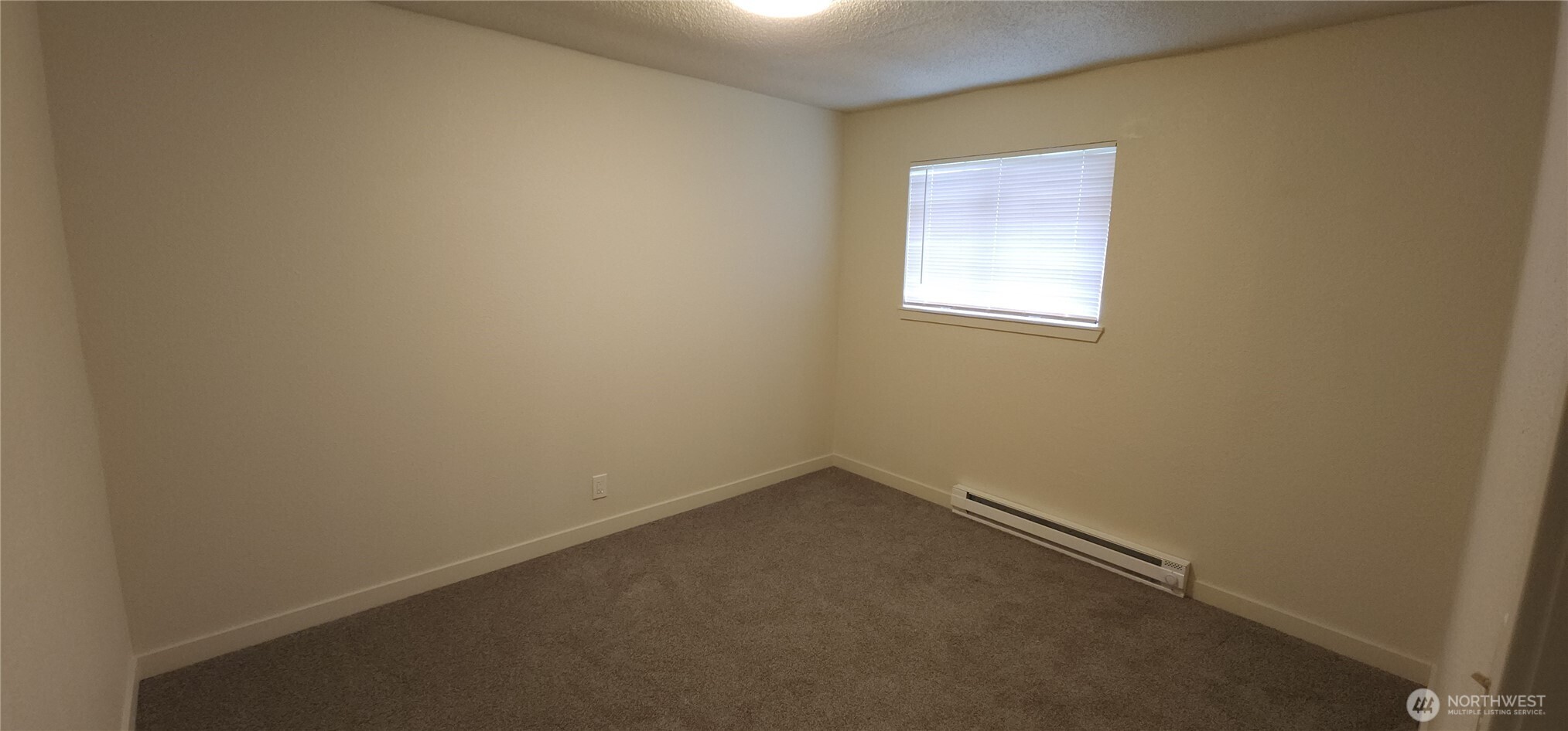 2350 East Pioneer Road Port Angeles, WA 98362 - Photo 30 of 40 an empty room with a window