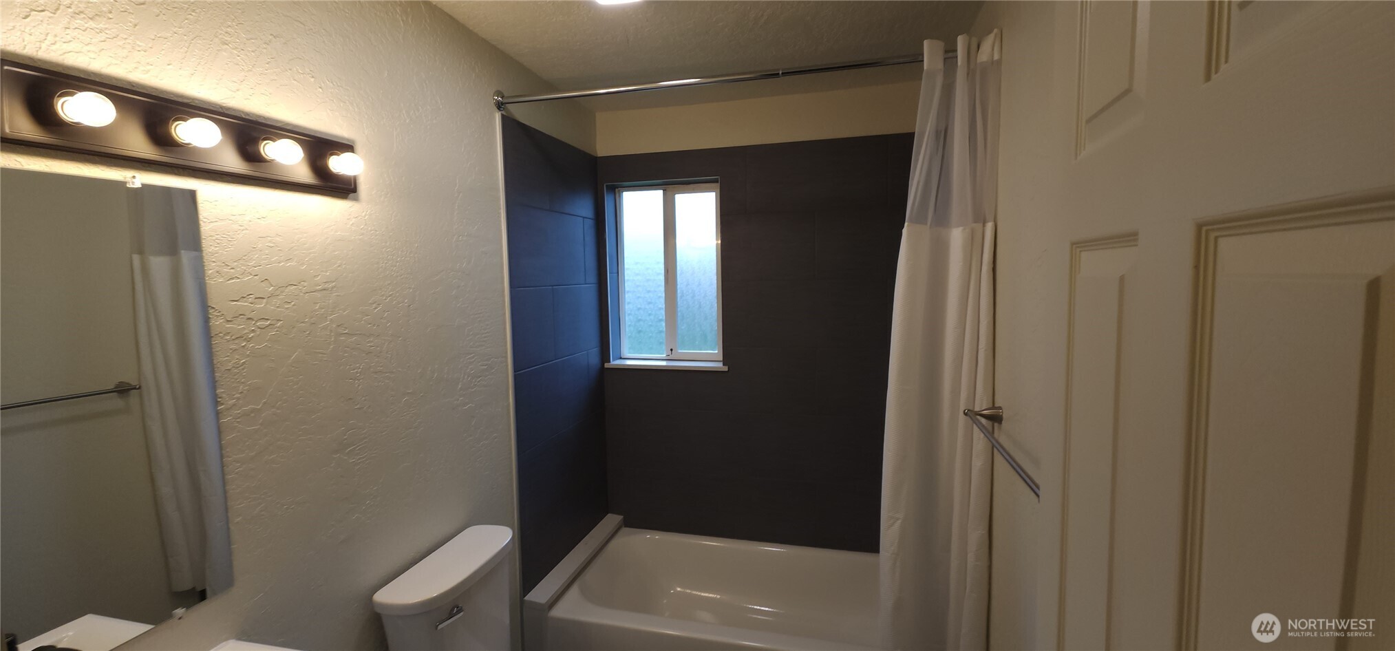 2350 East Pioneer Road Port Angeles, WA 98362 - Photo 32 of 40 a bathroom with a bathtub and shower