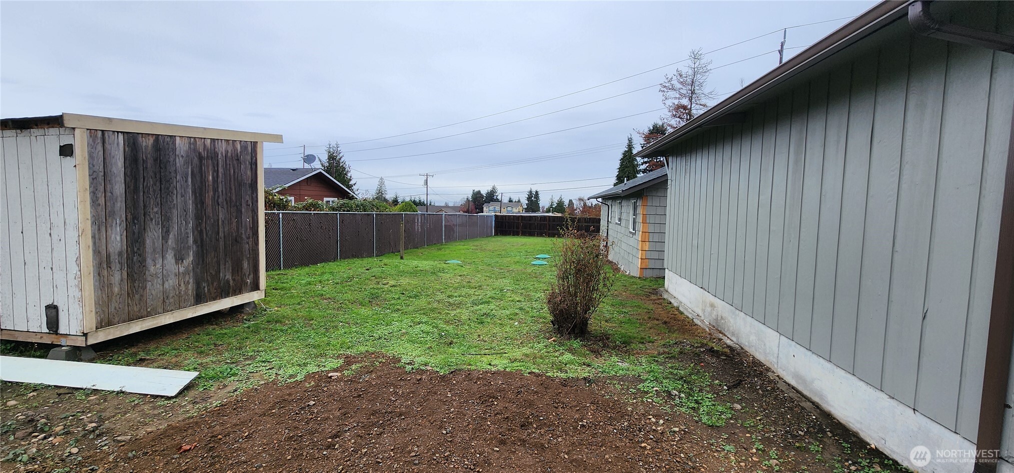 2350 East Pioneer Road Port Angeles, WA 98362 - Photo 7 of 40 a backyard of a house with lots of green space