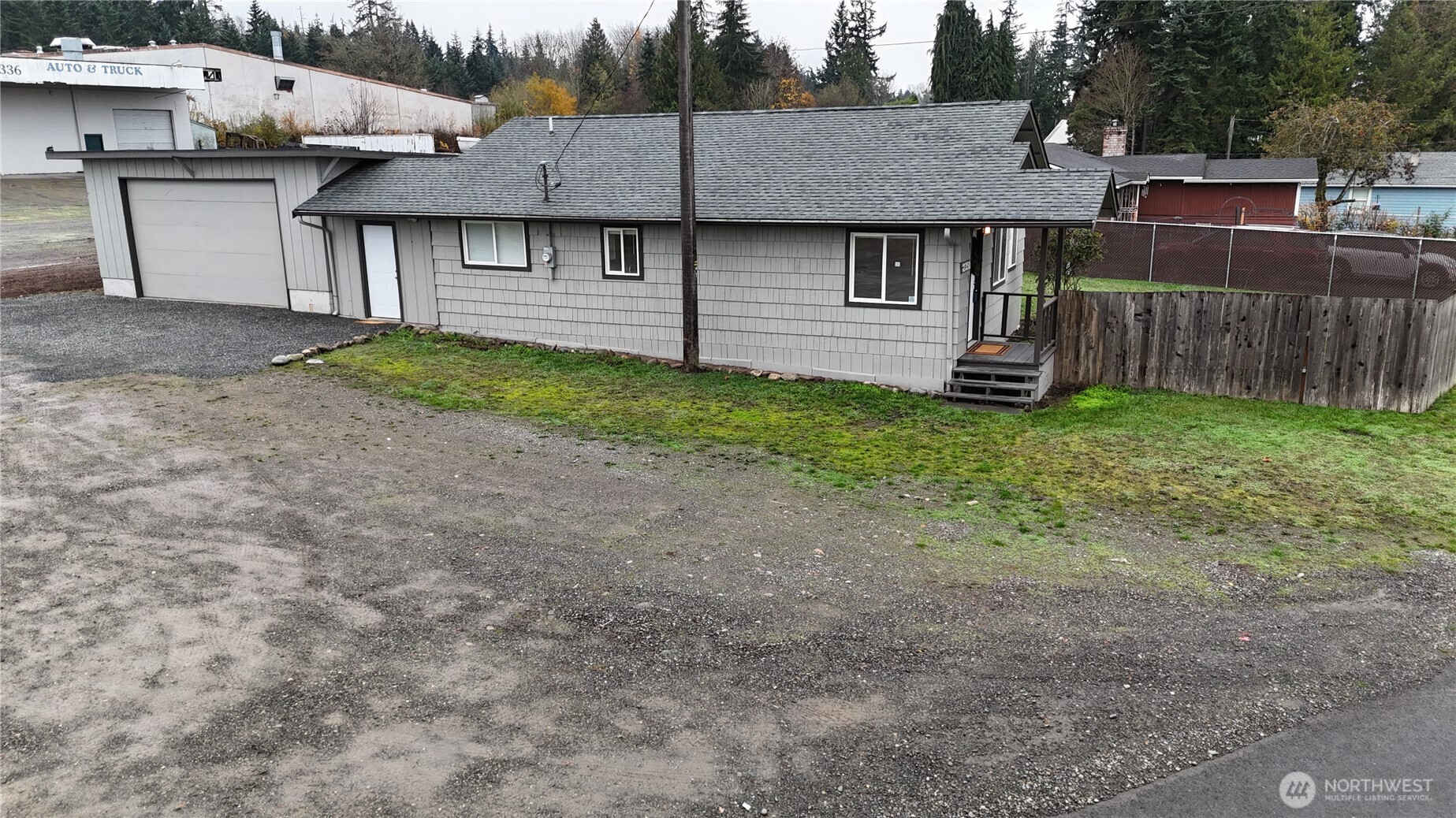 2350 East Pioneer Road Port Angeles, WA 98362 - Photo 10 of 40 a view of a house with a backyard and wooden fence