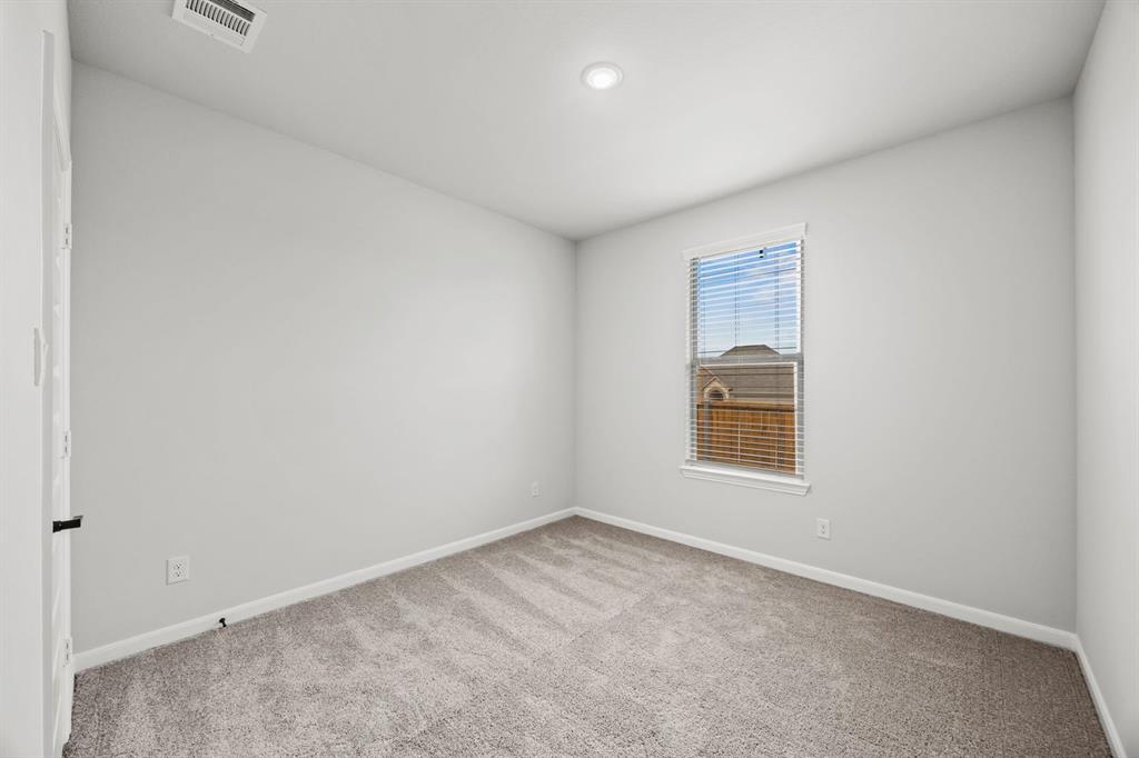 1507 Red Clover Avenue Van Alstyne, TX 75495 - Photo 17 of 30 an empty room with a window