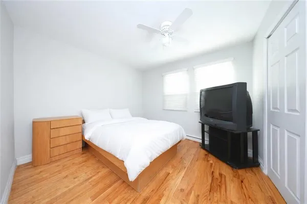 a bed room with a bed and a television
