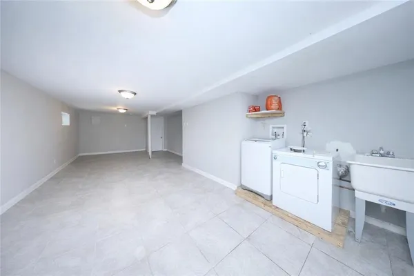 a view of storage and utility room with washer and dryer