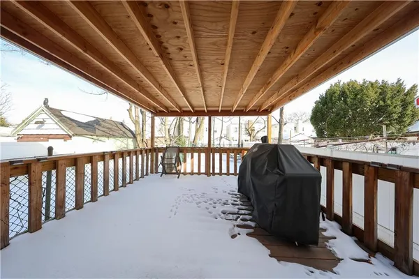 a view of porch with a sink and a wooden floor
