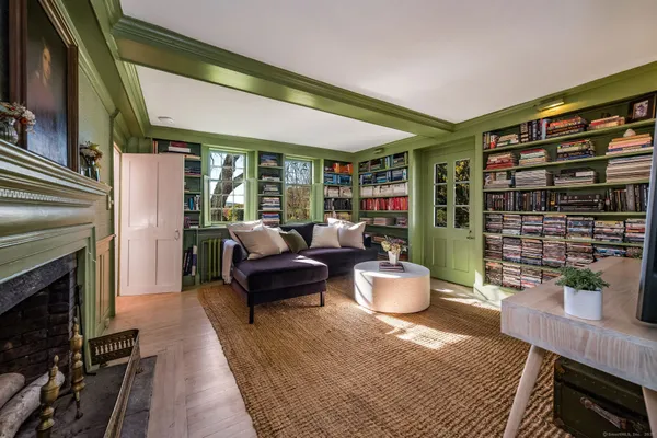 a living room with furniture and a fireplace