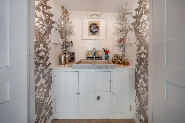 a bathroom with a sink and a mirror