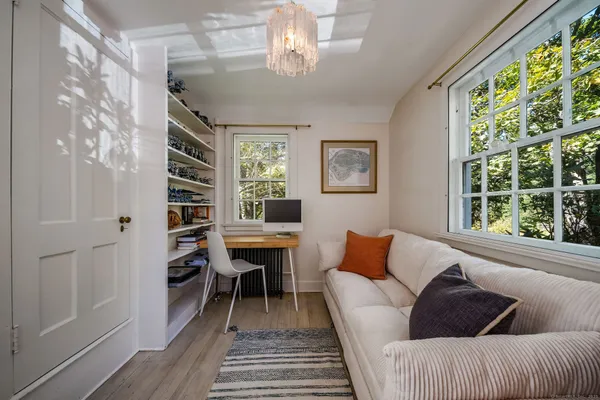 a living room with furniture and a window