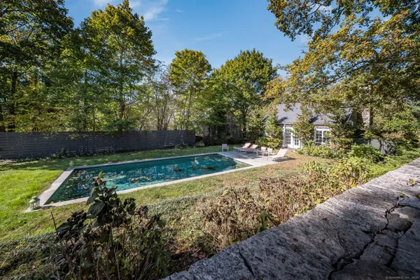a view of yard with large trees