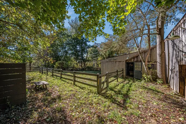 a backyard of a house with lots of green space