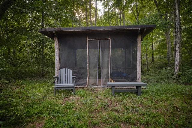 a view of a wooden door in the back yard